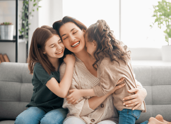 Mother and daughters happy after light code activation series complete